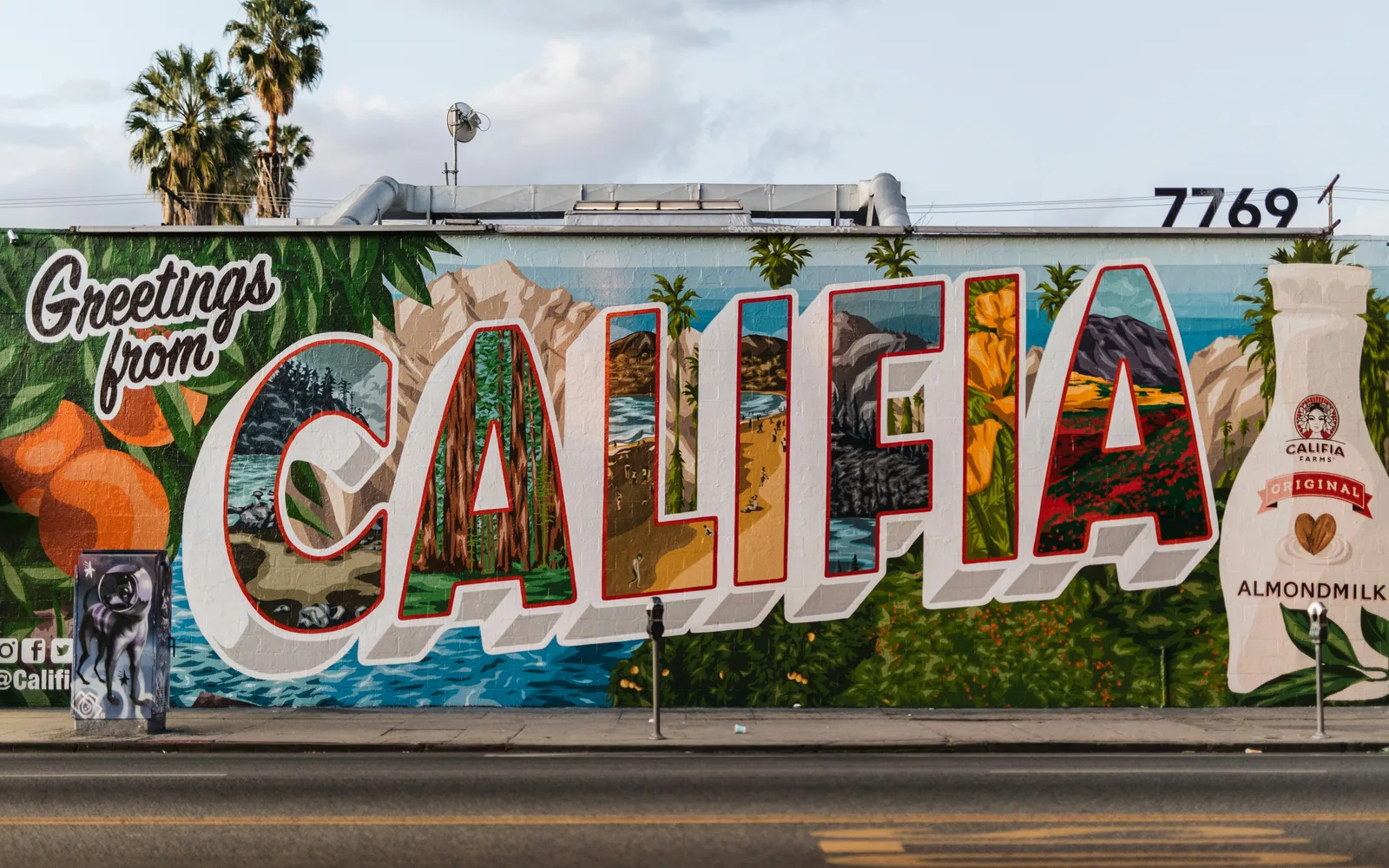 Vibrant street mural with colorful cultural lettering from California
